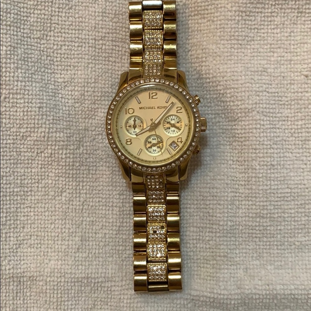 Michael Kors gold watch -missing some gems in band